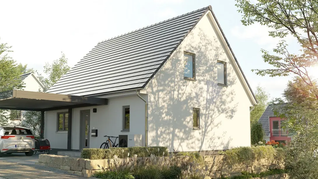 Modernes Massivhaus mit Satteldach und Carport in einem ruhigen Wohngebiet – Beispiel für die individuelle Hausplanung und hochwertige Bauausführung von HIS Hausbau in der Region Lutherstadt Wittenberg.
